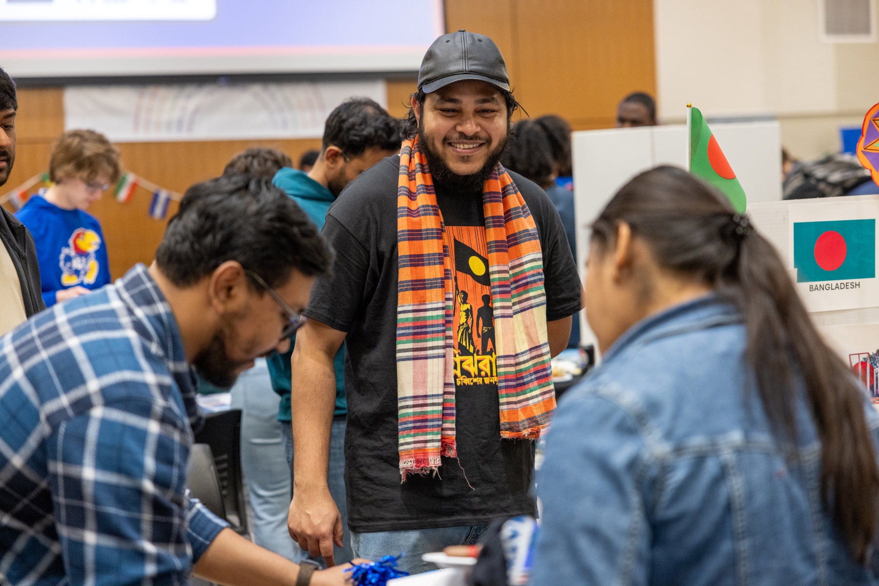 KU students talk at a booth at the International Jayhawk Festival, held at the Burge Union. 