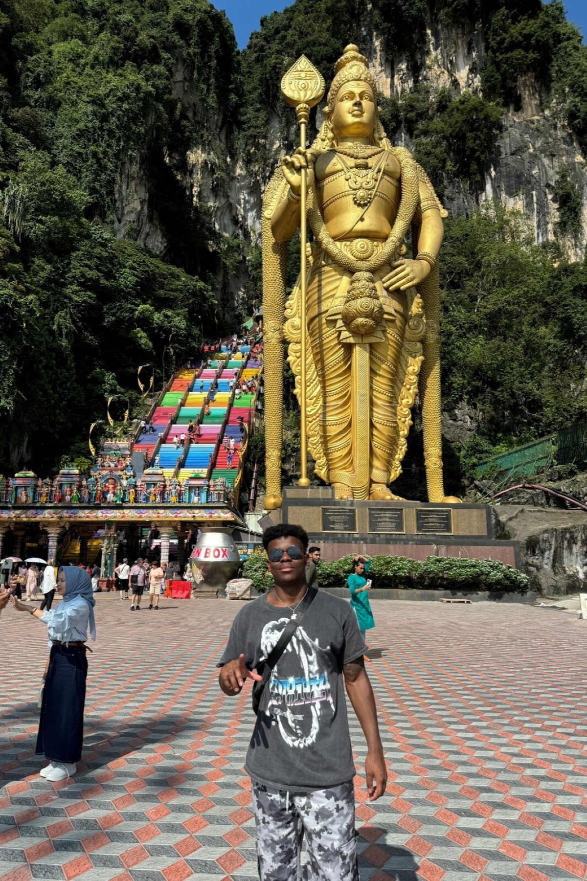 University of Kansas student James Price poses in front of the rainbow stairs on a study abroad trip to Malaysia.