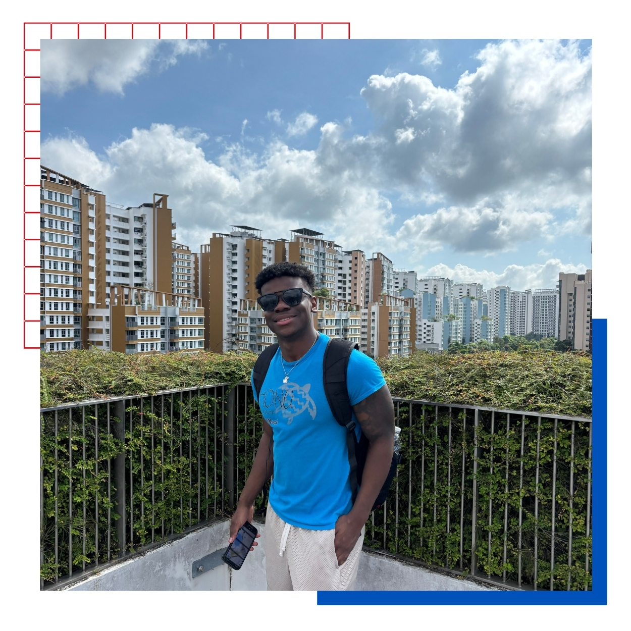 University of Kansas Architecture student James Price poses in front of buildings in Singapore on a study abroad trip to Asia.