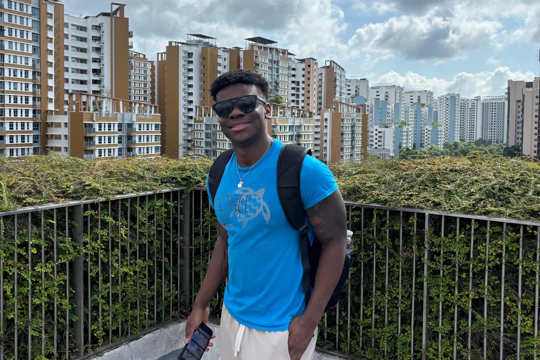 University of Kansas Architecture student James Price poses in front of buildings in Singapore on a study abroad trip to Asia.