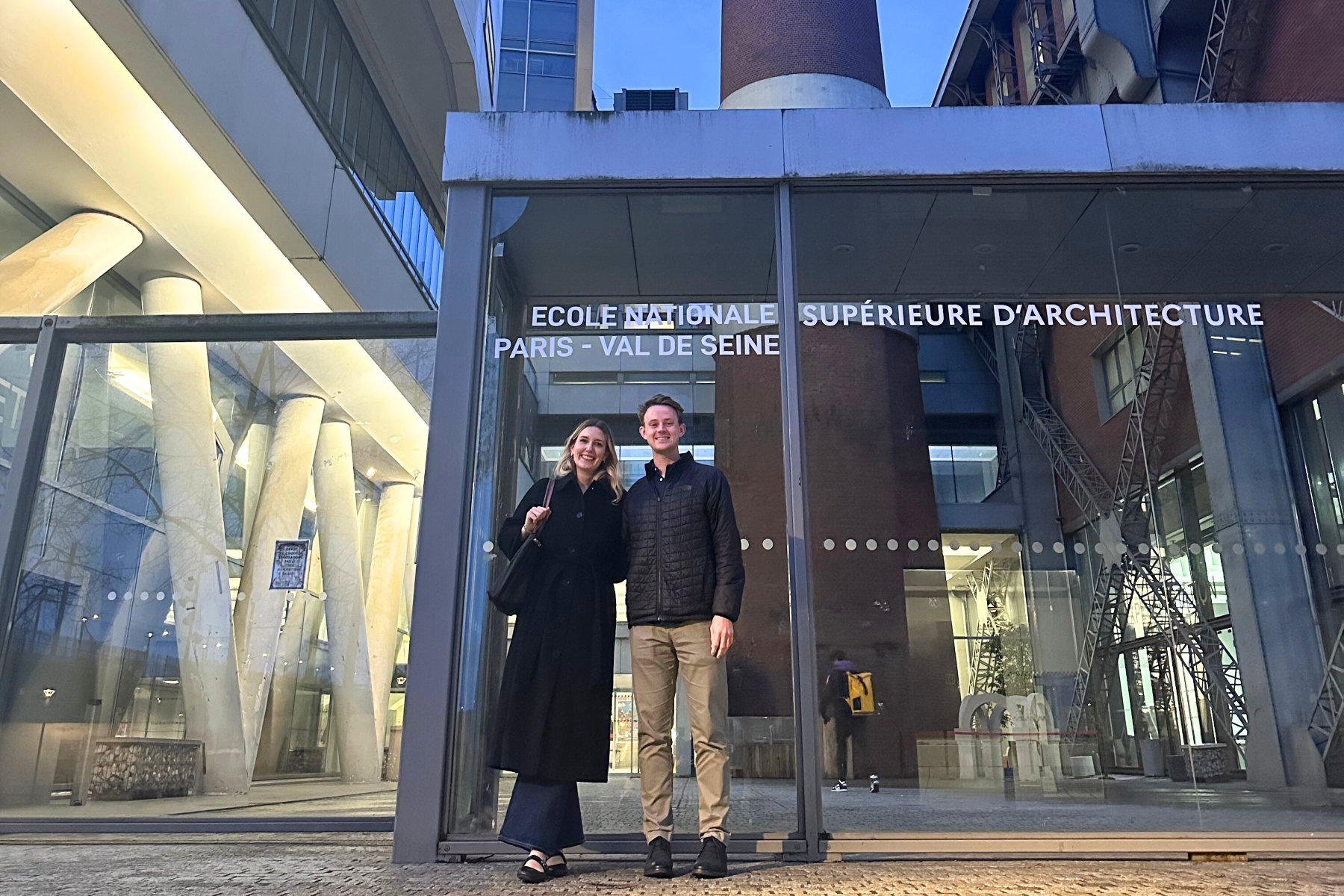 University of Kansas student Adam Cory is pictured in front of an architecture firm during study abroad in Paris with KU student Sara Rowley.
