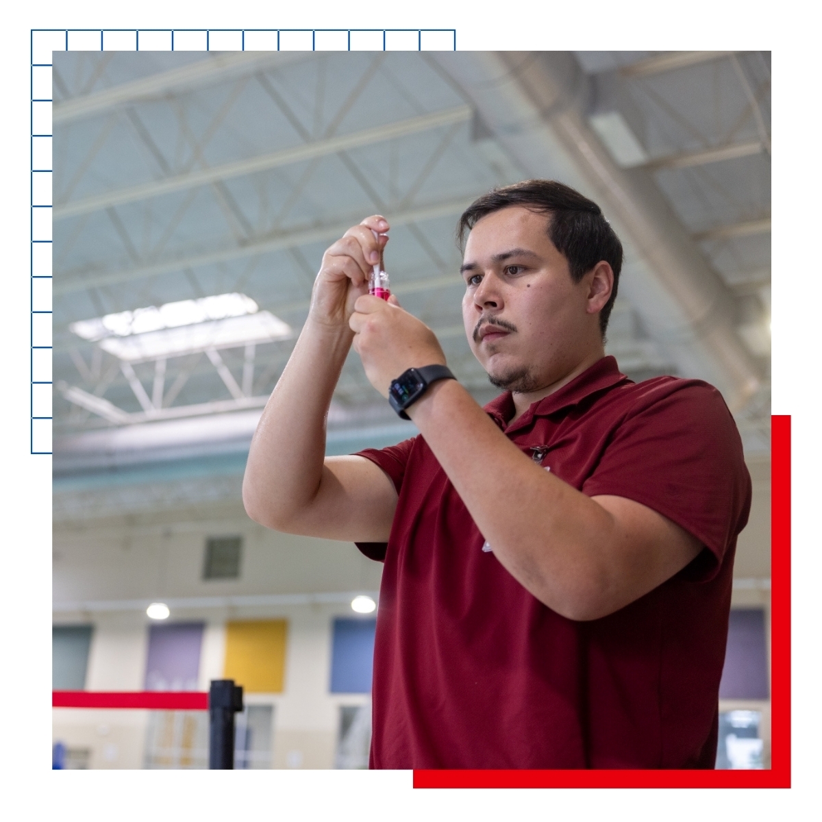 KU Community Health alumnus Enrique Ortiz inspects pool water as part of his career.