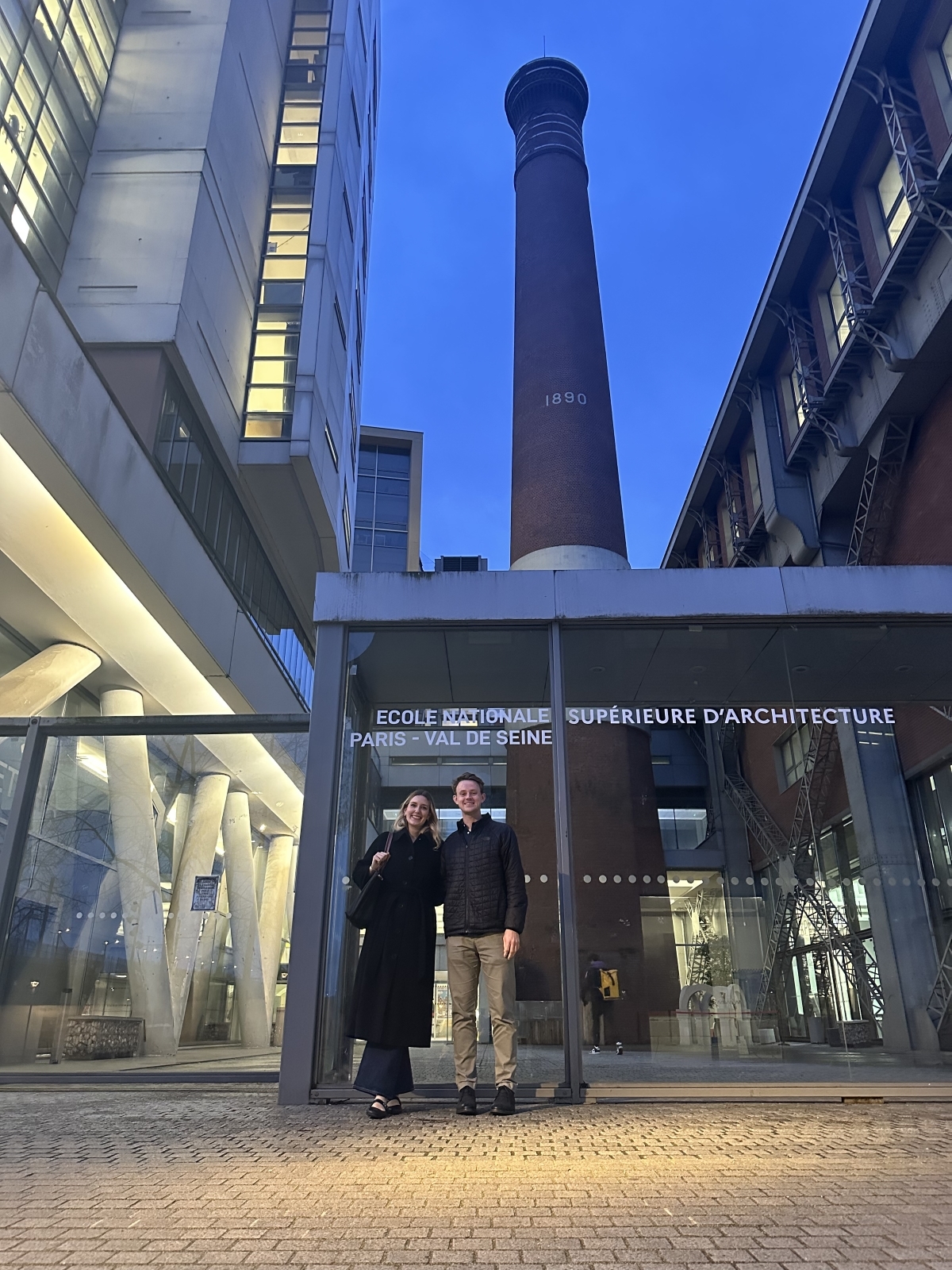 University of Kansas student Adam Cory is pictured in front of an architecture firm during study abroad in Paris with KU student Sara Rowley.
