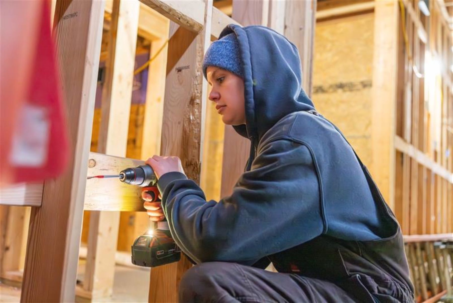 University of Kansas student Madeline Bachelor works on the interior of the 2025 Studio 804 build.