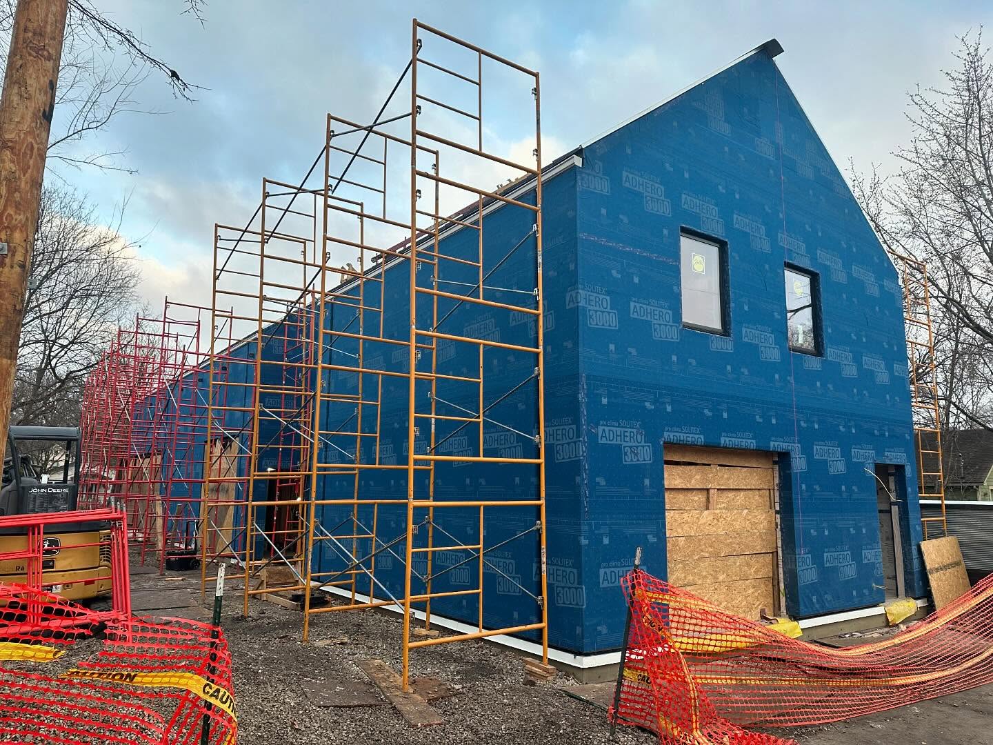 The exterior of the University of Kansas Studio 804 2025 home build, wrapped in blue insulation.