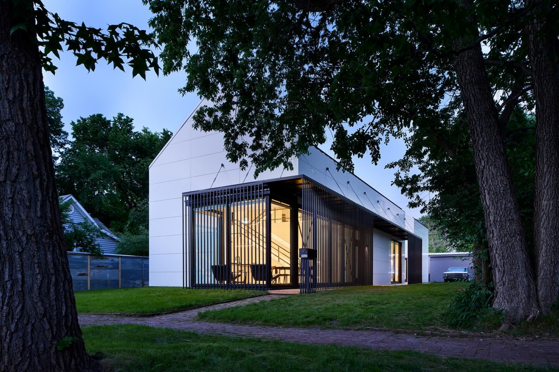 An evening shot of the exterior of the University of Kansas Studio 804 home build from 2025.