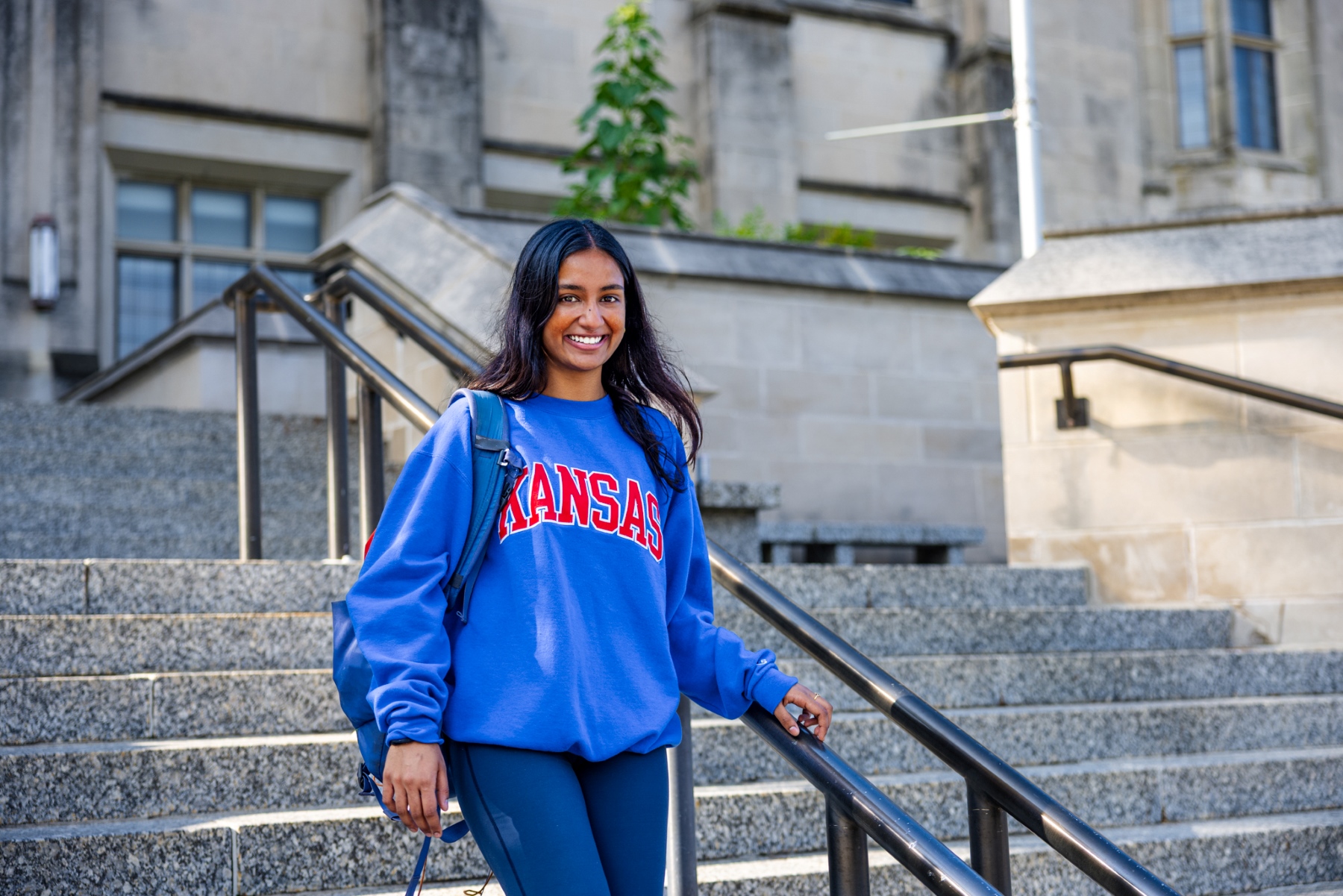 University of Kansas School of Engineering student Alice Mungamuri on the steps of Watson Library on the KU campus.