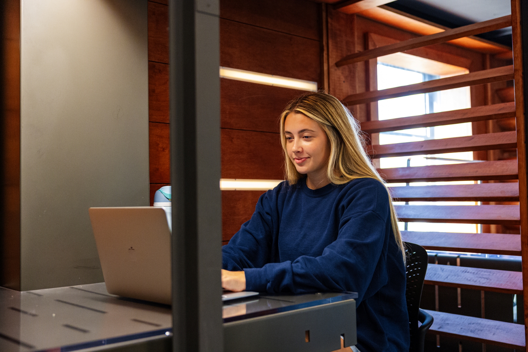 University of Kansas student ambassador Audrey Inman works at a computer in Watson Library. 