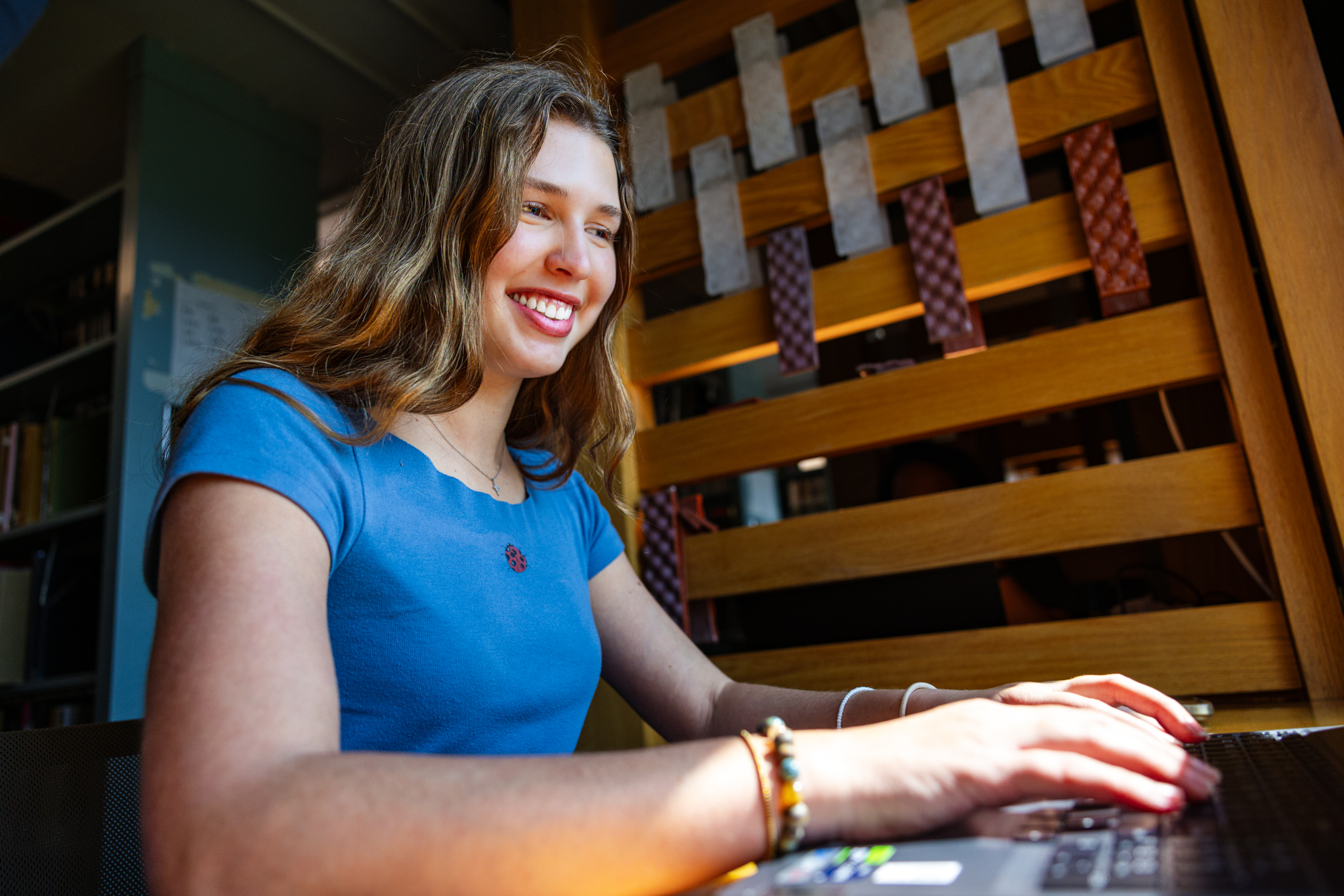 University of Kansas student Celeste Ruisinger studies at a desk inside Watson LIbrary