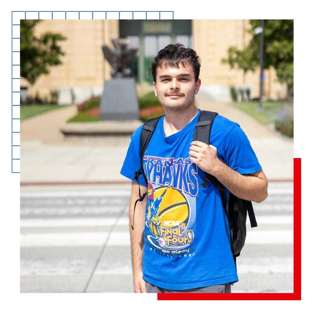 University of Kansas student Oscar Sanchez Christensen on campus in front of Strong Hall