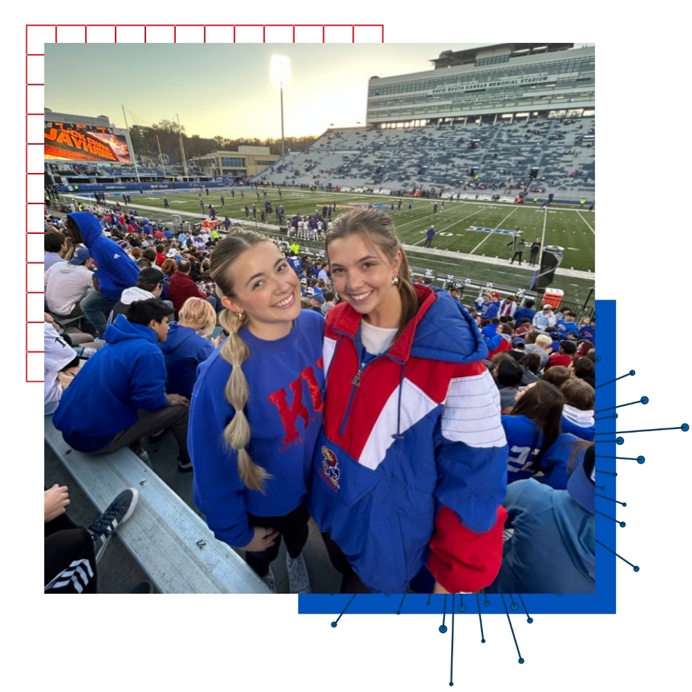 KU student Audrey Inman with a friend at a football game.