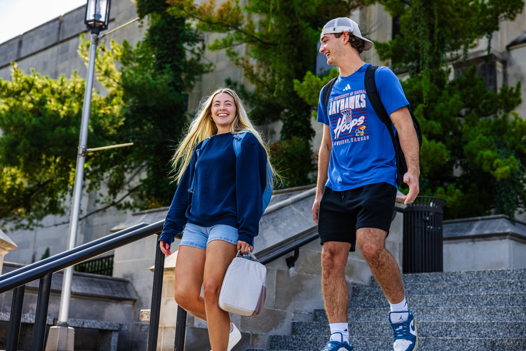 University of Kansas students Audrey Inman and Simon Willis on the steps of Watson Library.