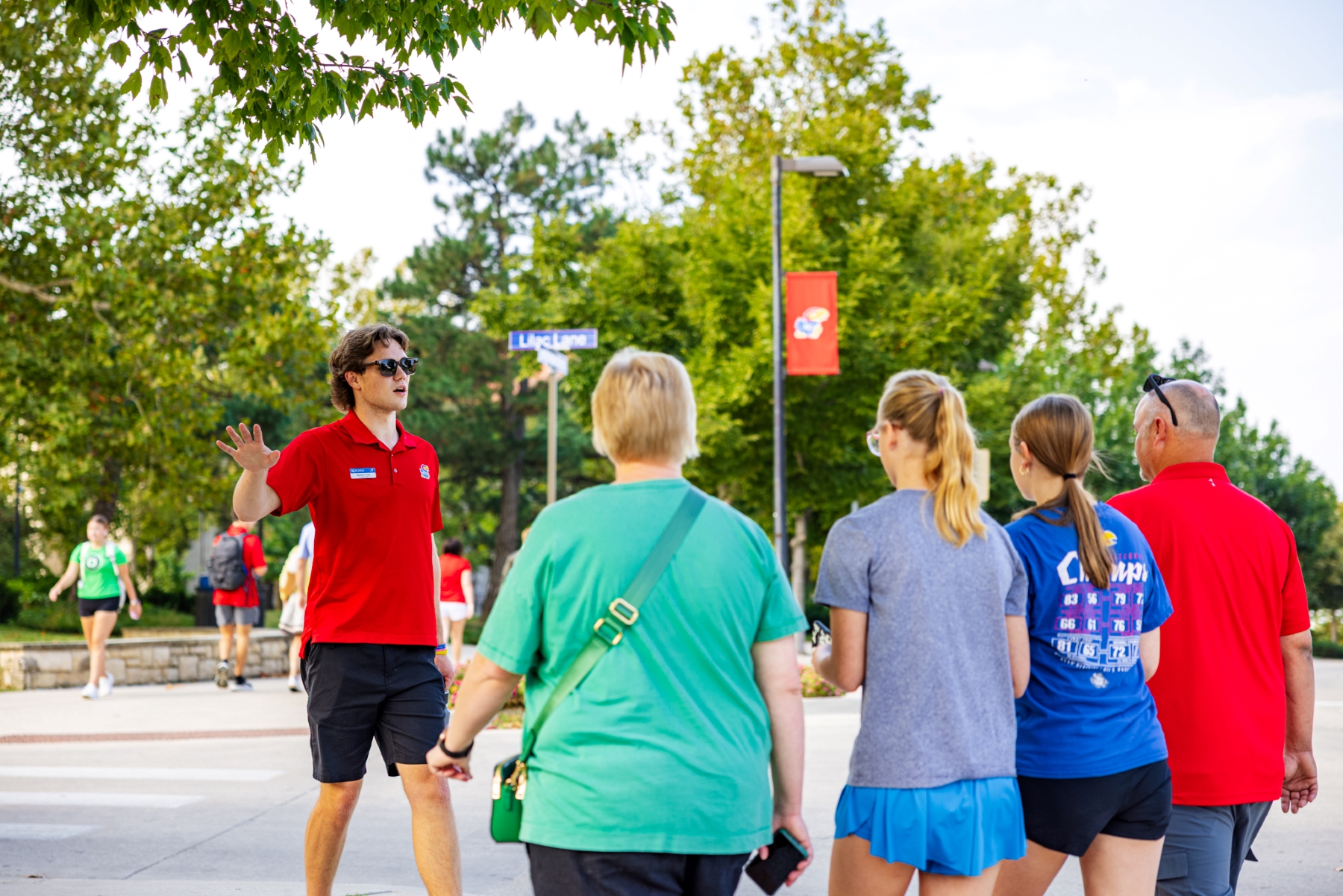Student ambassador Jackson Fries takes future University of Kansas students on a KU campus tour.