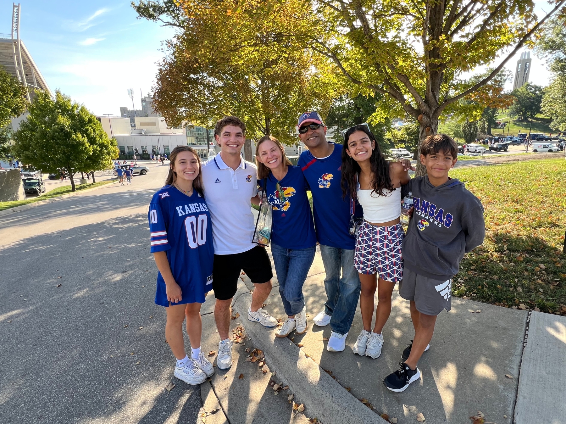 A family poses for a picture during KU Family Weekend 2025.