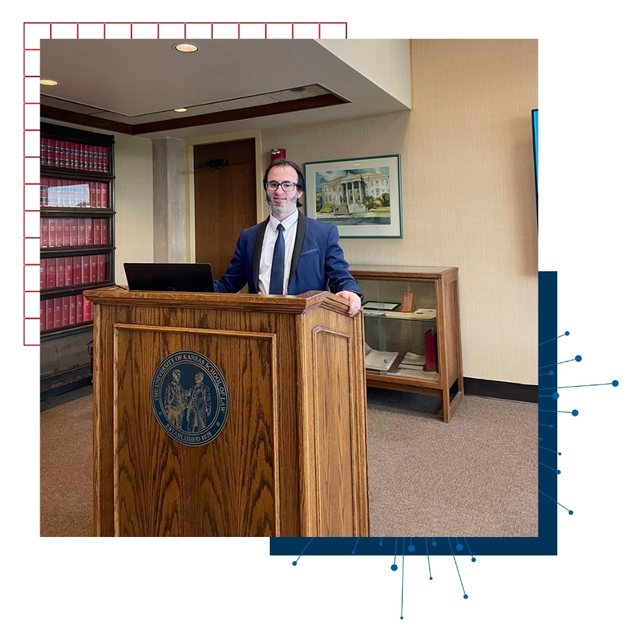International alumnus Bander Almohammadi of the University of Kansas School of Law presents from a podium