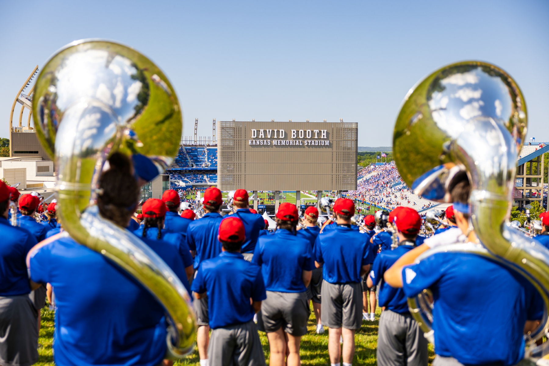 The University of Kansas Marching Jayhawks on the Hill in front of the David Booth Kansas Memorial Stadium during Family Weekend.