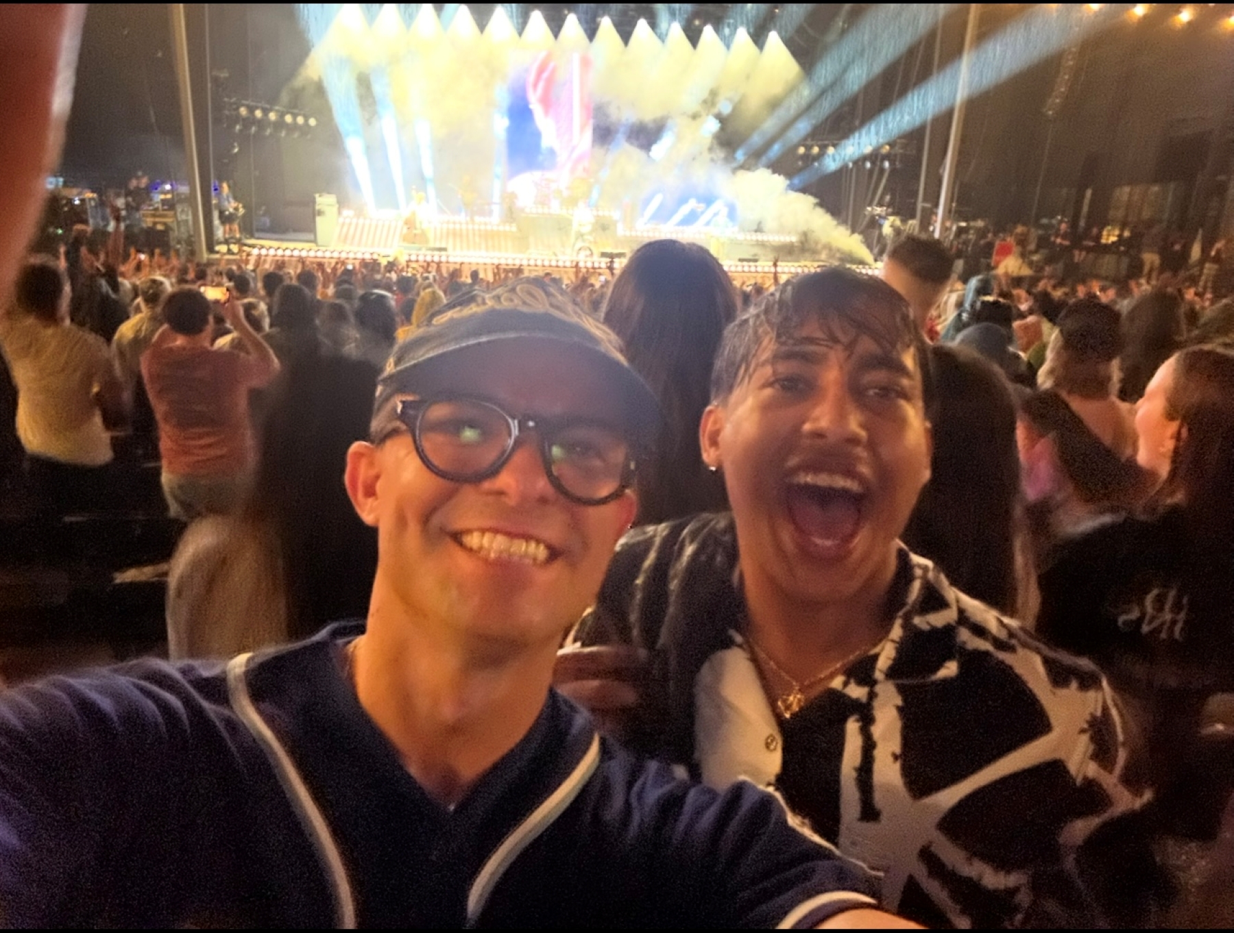 University of Kansas student Pritam Ray at a concert in the rain with his faculty mentor Tom Gonzalez.