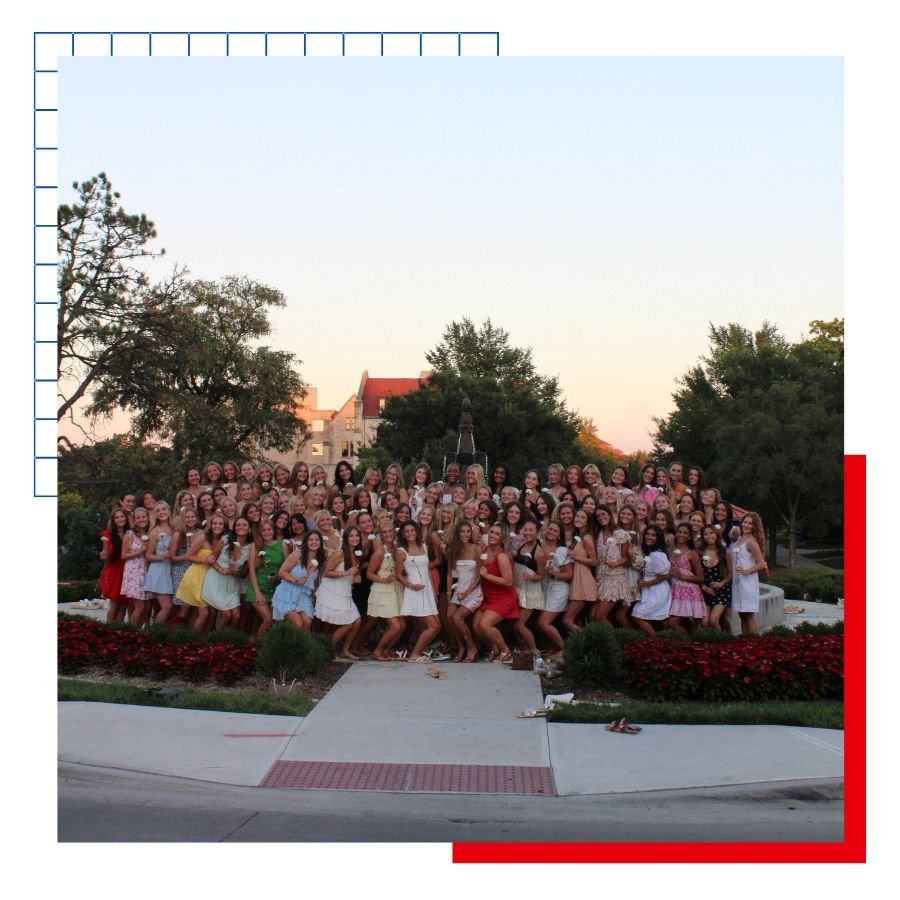 University of Kansas freshmen pose in front of the Chi Omega fountain during sorority recruitment week.