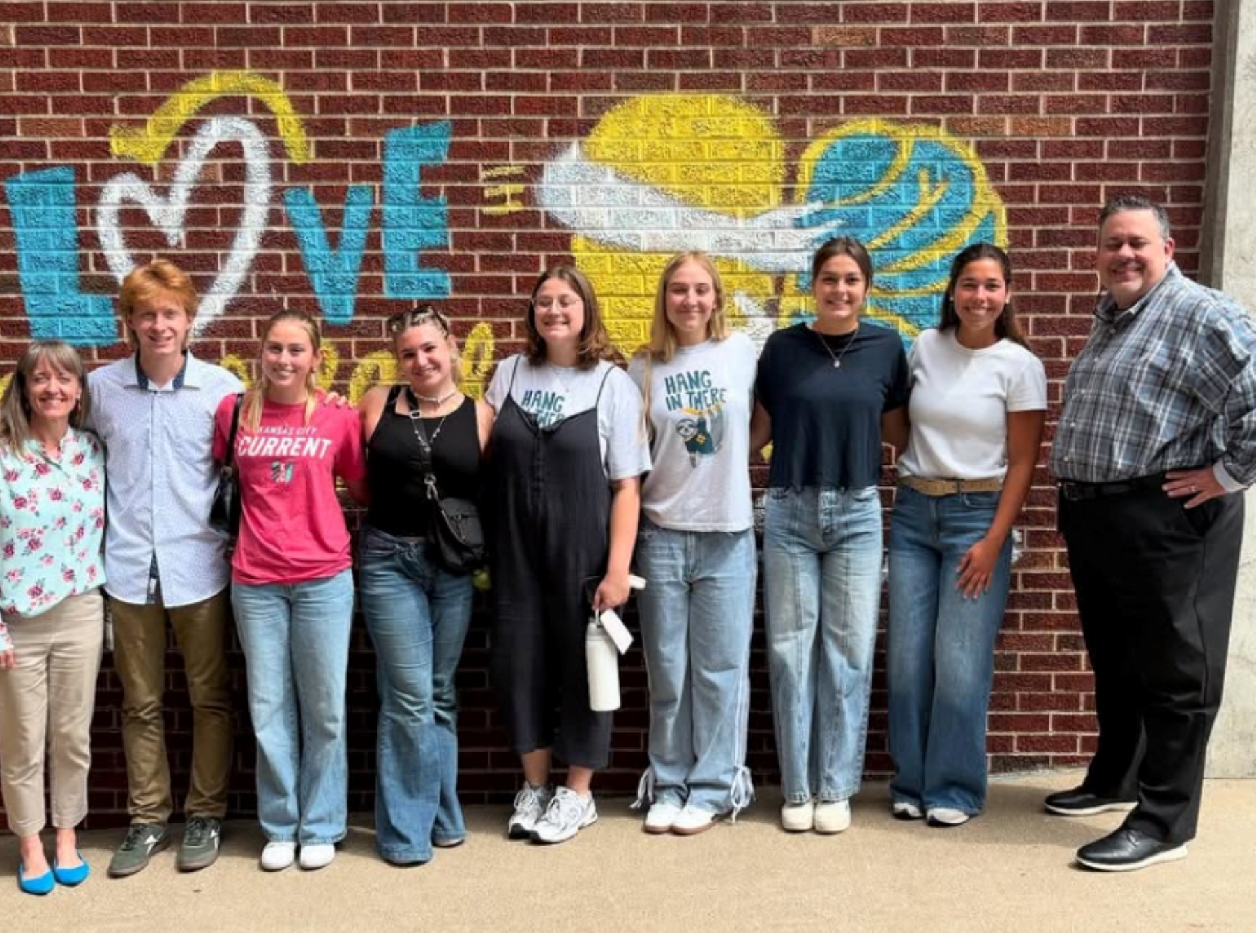 University of Kansas student Caroline Rome poses with an group of students participating in Johnson County Mental Health Center psychology internships.