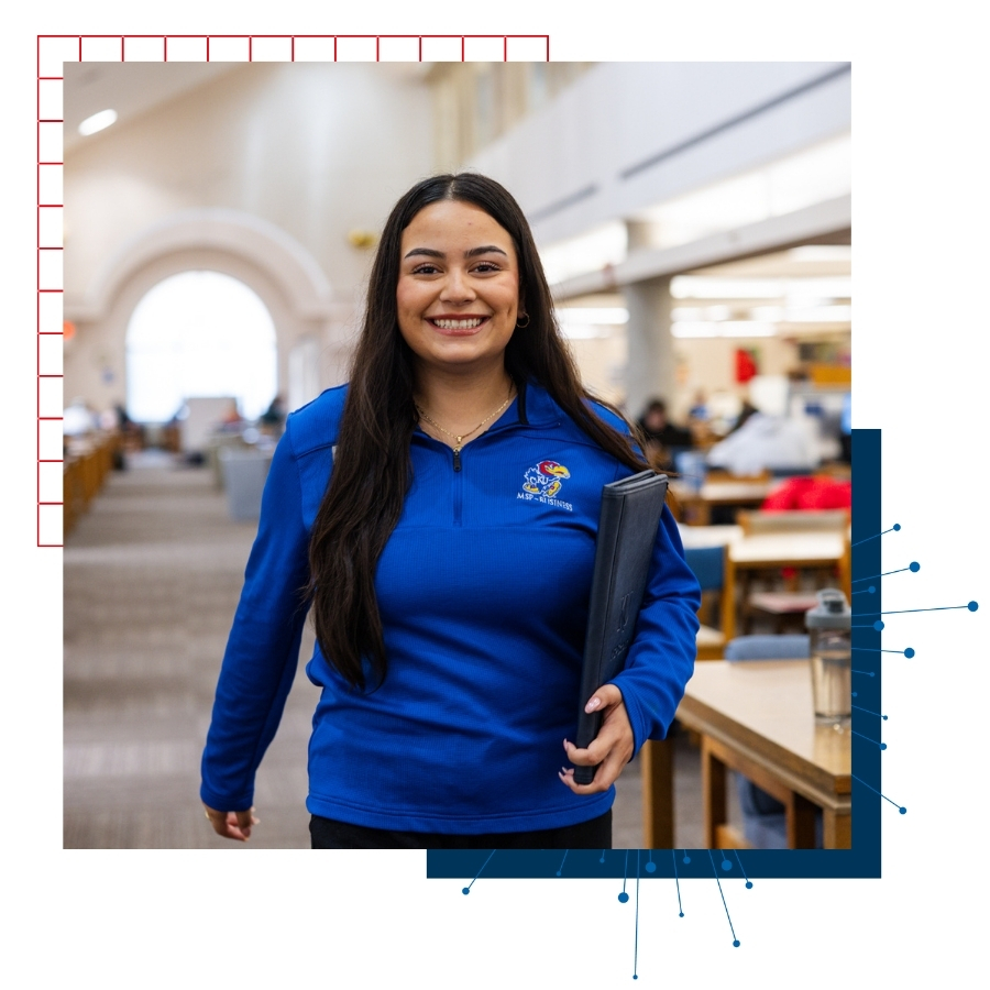 University of Kansas student Annalia Esalante is pictured walking in the Anschutz Library.