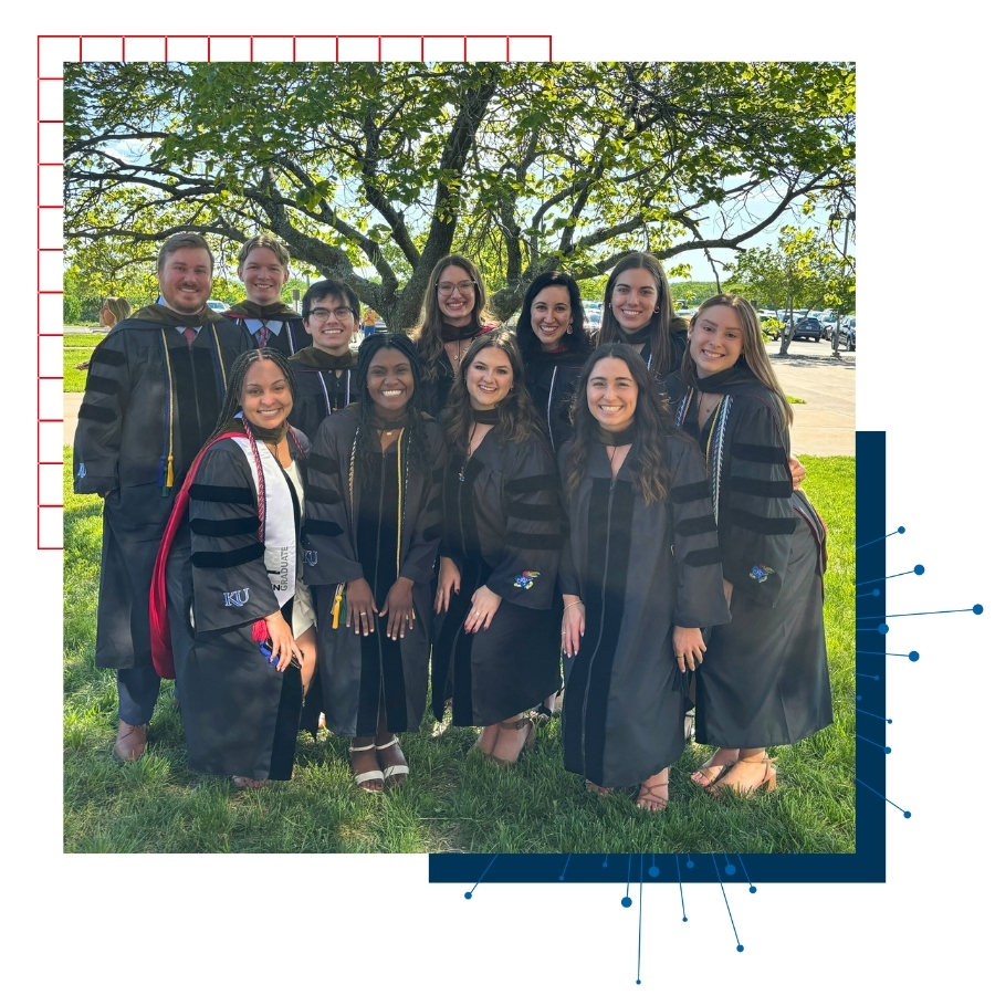 University of Kansas School of Pharmacy graduates pose for a group photo on graduation day.