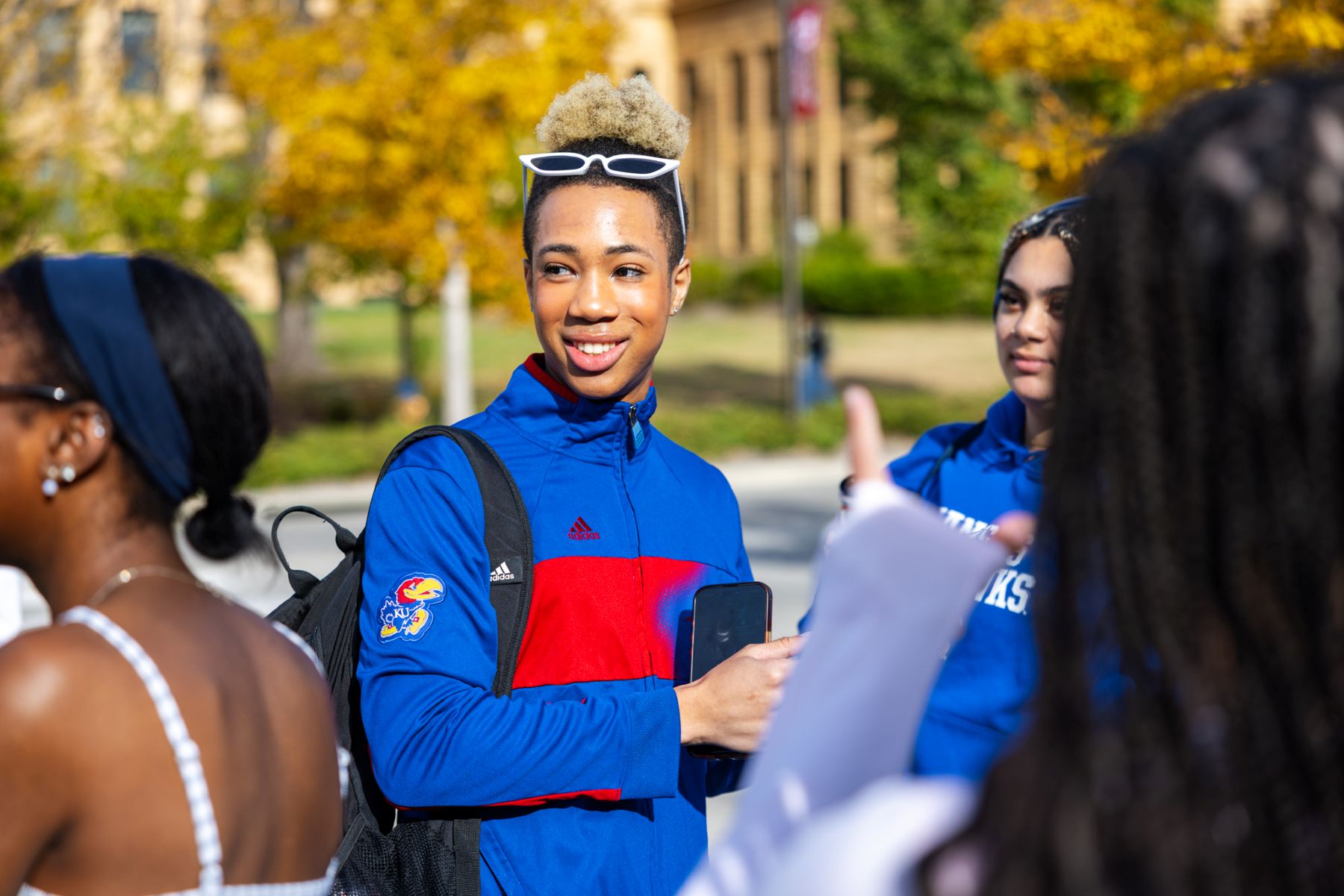University of Kansas student Joshua Alston visits with friends on Wescoe Beach on the KU campus.