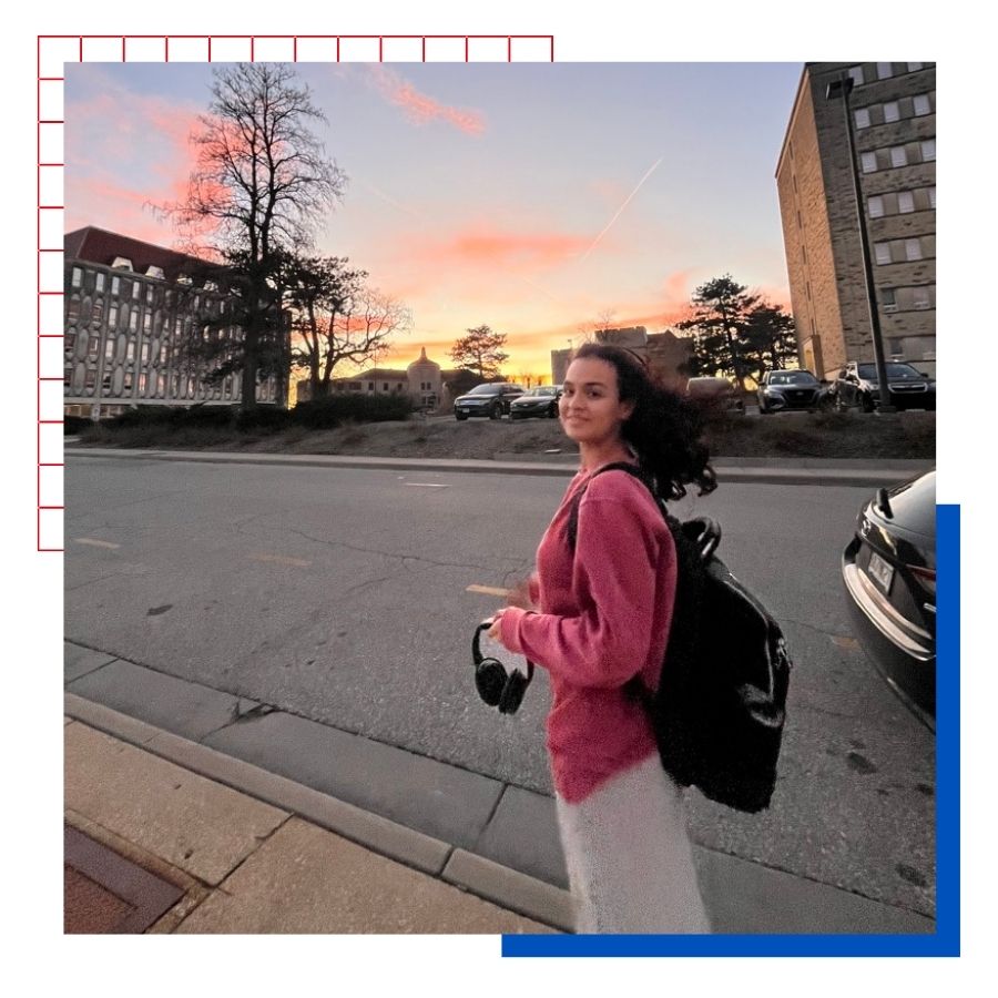 University of Kansas international student Ana Pineda poses on the KU campus with a sunset in the background