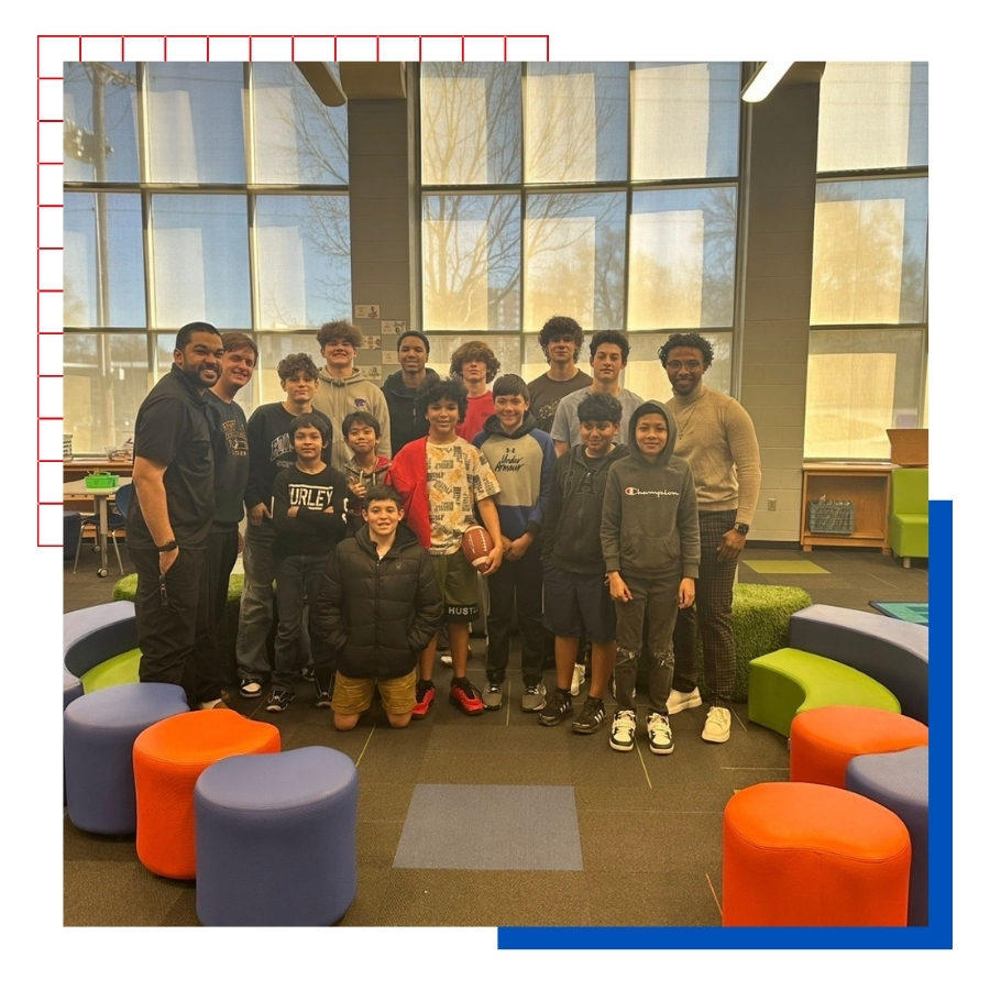 KU alumnus Javen Betts is pictured with a student organization he started called "Men of Excellence". The emphasis is teaching 6th grade young men manners, etiquette, and providing mentorship.