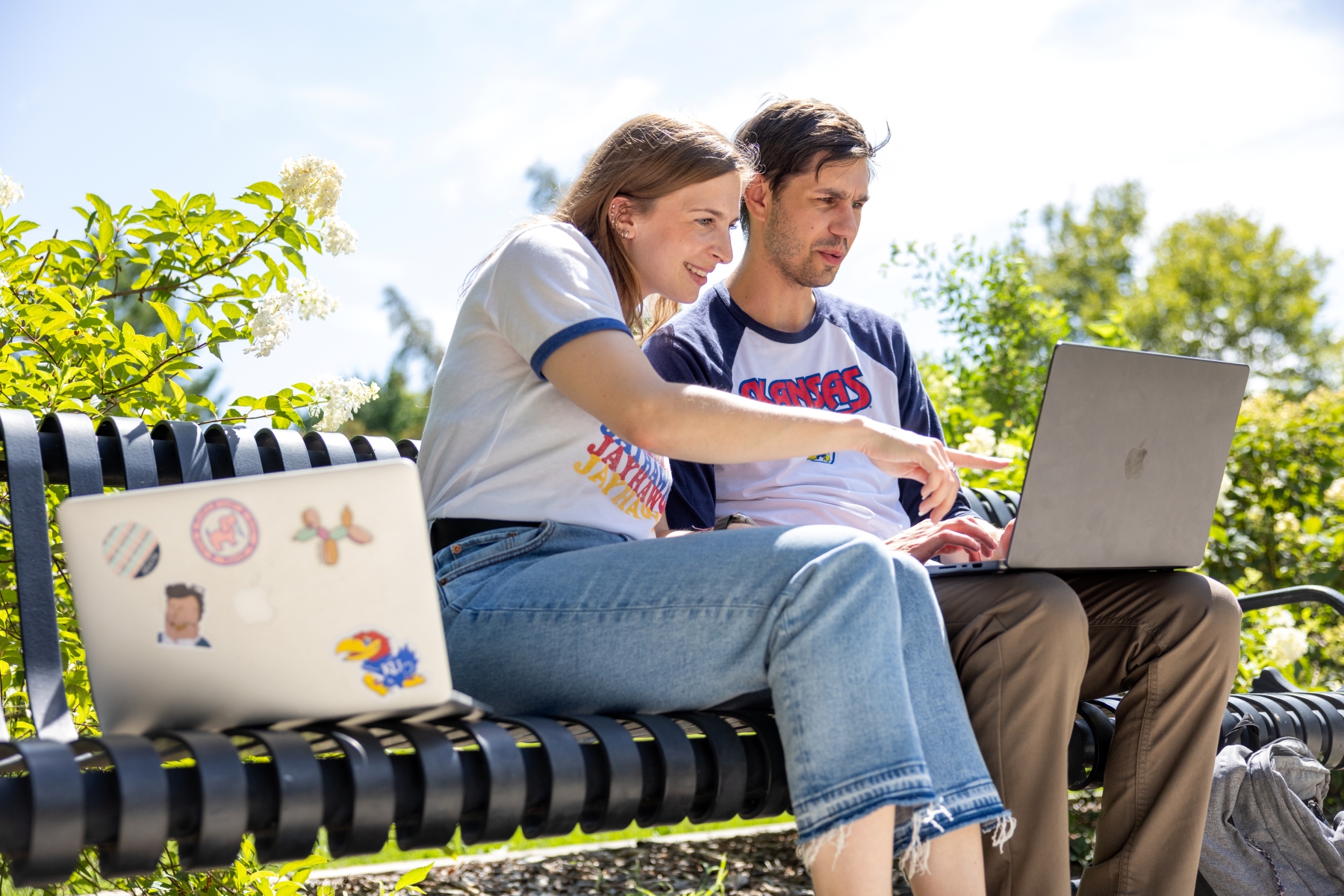 Two KU online students study at South Park on Massachusetts Street in downtown Lawrence Kansas