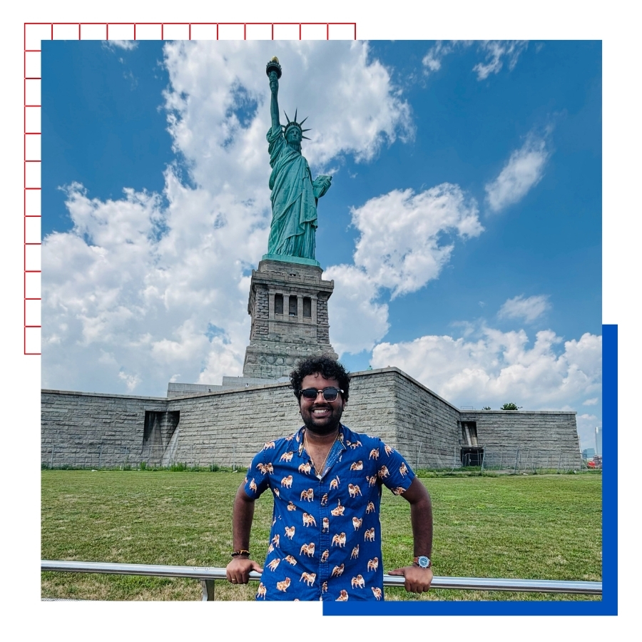 University of Kansas international student Tej Gumaste poses in front of the Statue of Liberty.