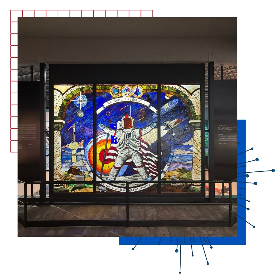 A stained glass piece of art featuring an astronaut at the Kansas Cosmosphere.