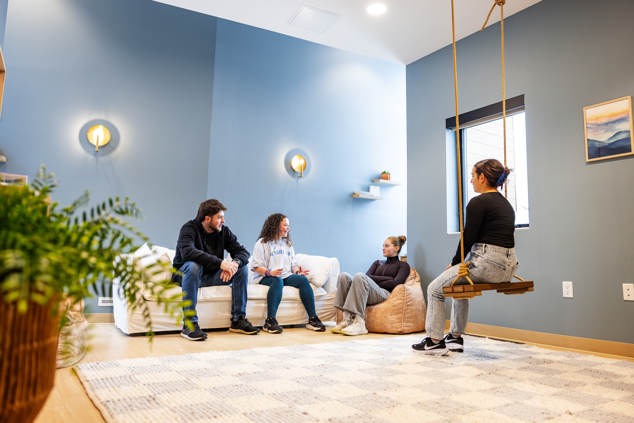 KU students gather in the living room of the new Chabad Center for Jewish life at the University of Kansas.