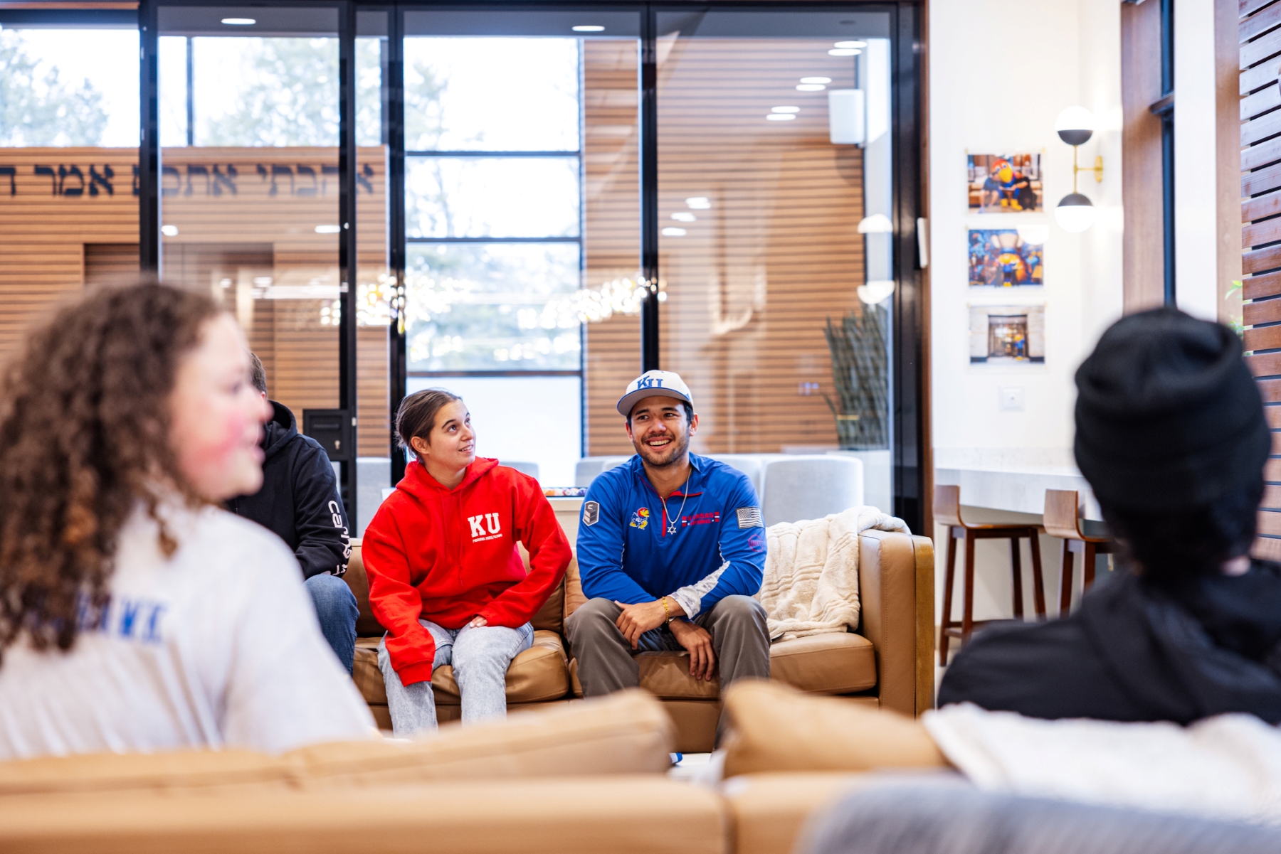 KU students gather in the living room of the new Chabad Center for Jewish life at the University of Kansas.