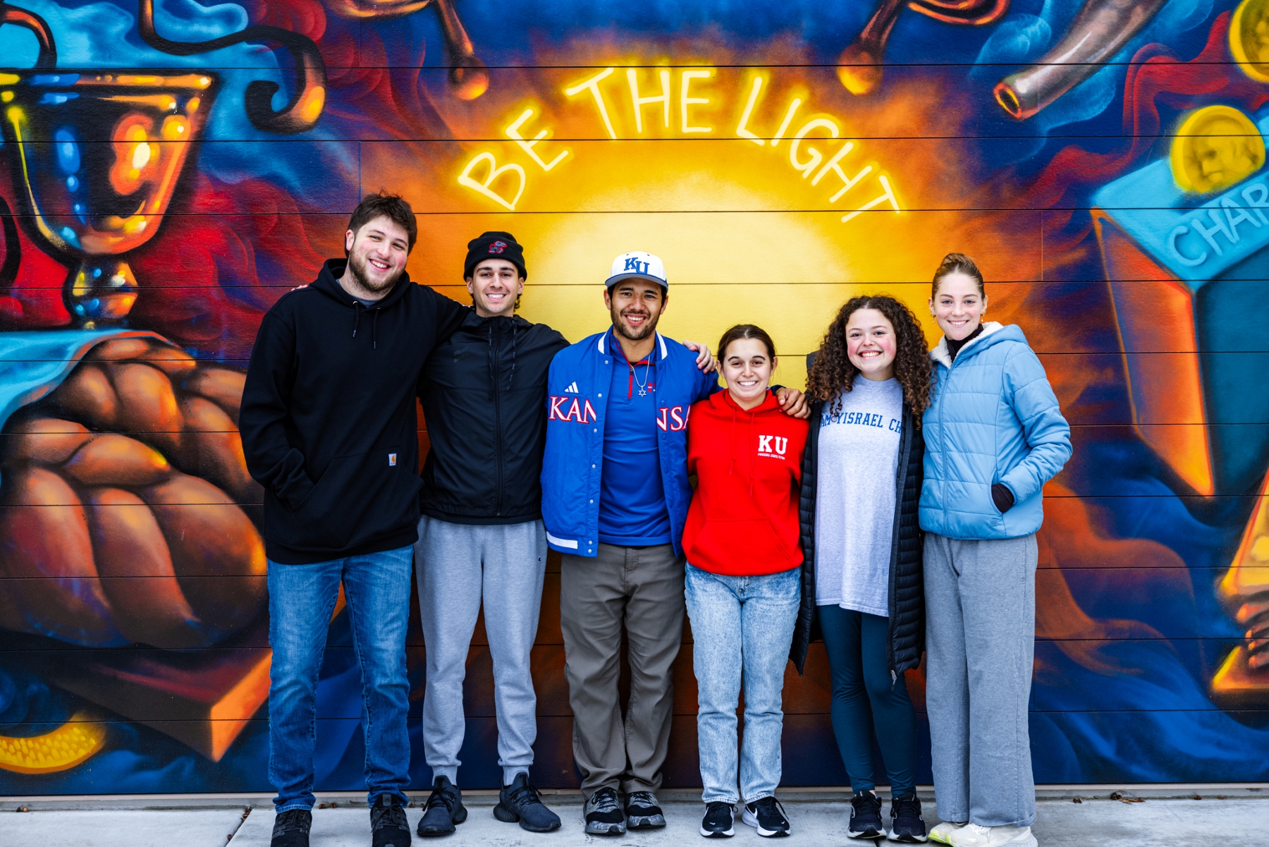 University of Kansas students gather in front of the new KU Chabad Center for Jewish student life.