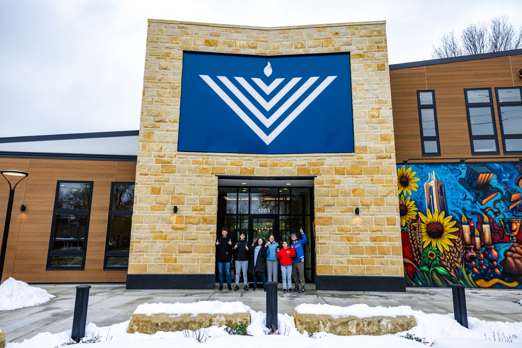 University of Kansas students gather in front of the new KU Chabad Center for Jewish student life.