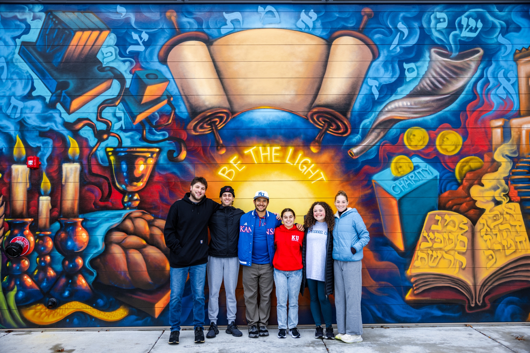 University of Kansas students gather in front of the new KU Chabad Center for Jewish student life.