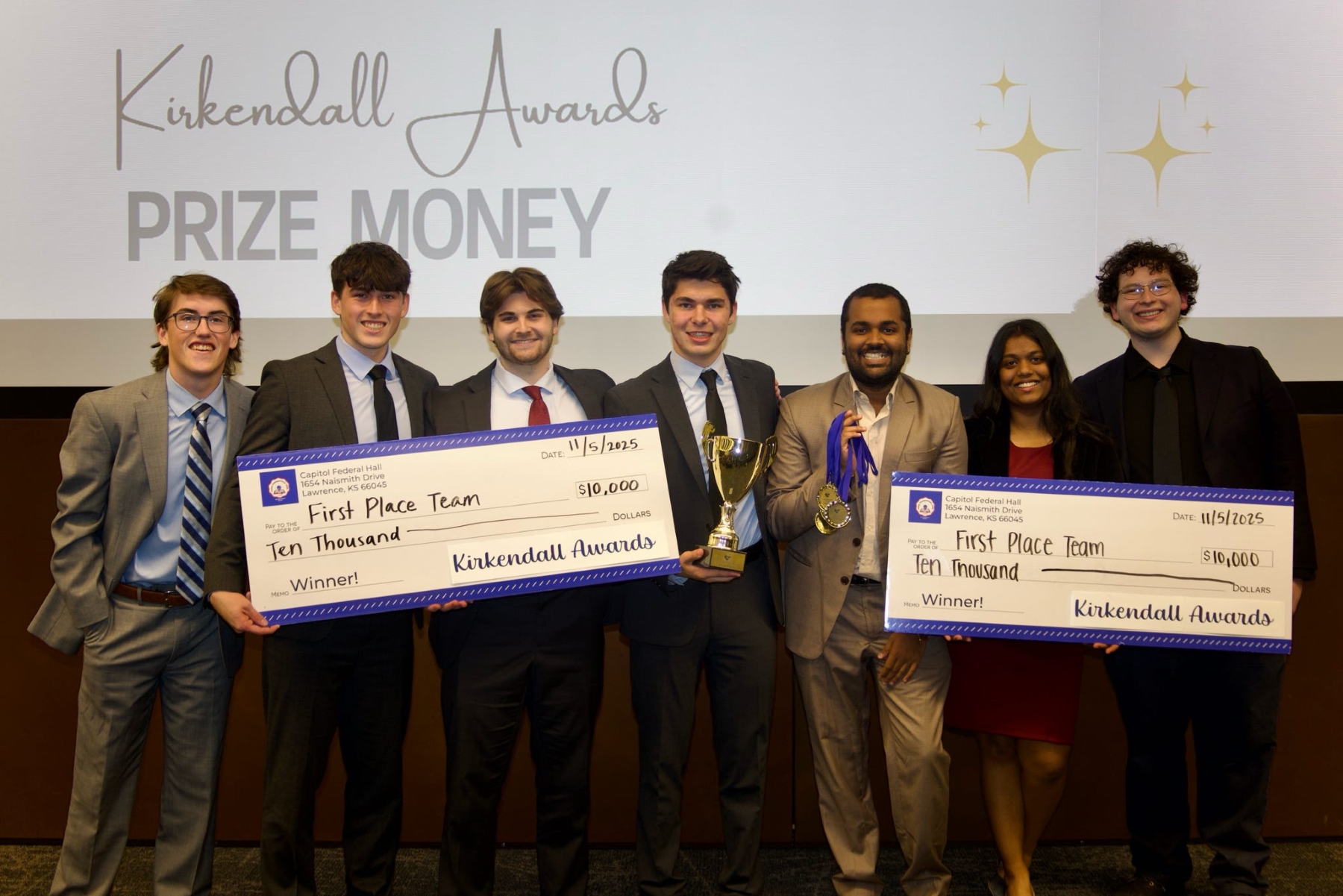 University of Kansas students hold a large check for $10,000 due to winning first place in the Kirkendall Awards Challenge. 