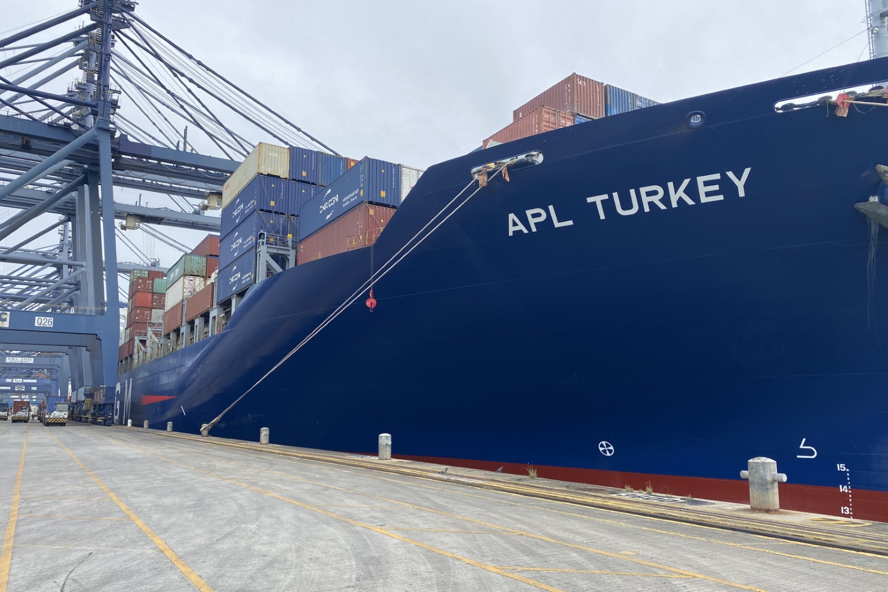 A giant cargo ship filled with shipping containers at port in Panama on a study abroad trip for a KU supply chain management student.