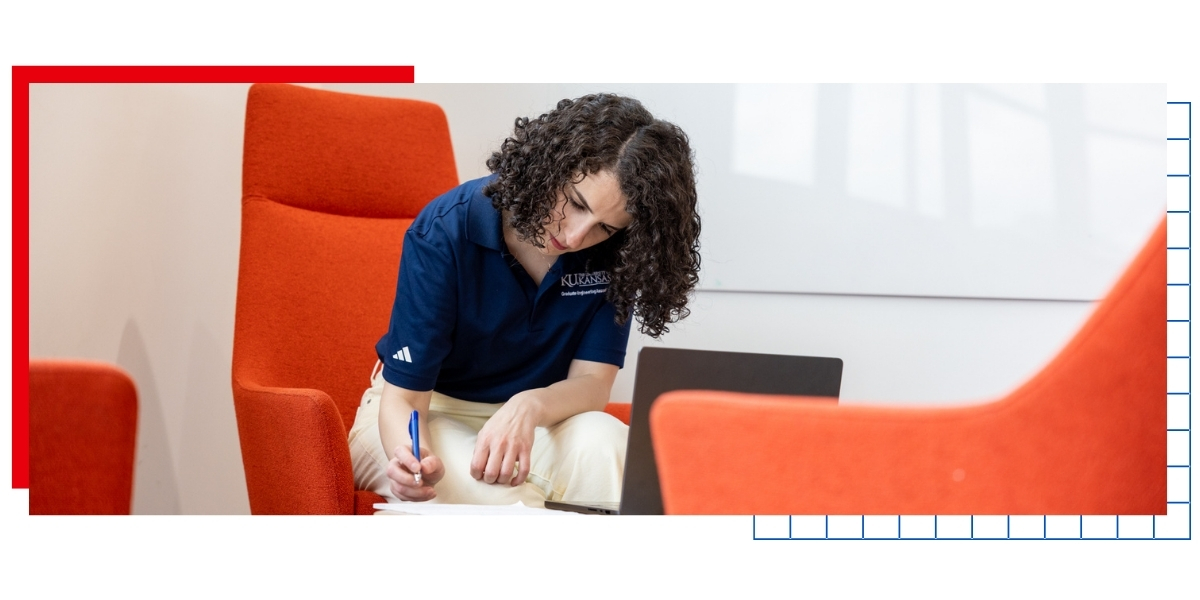 University of Kansas graduate student Mona Shaheen works at a laptop in a KU campus building.