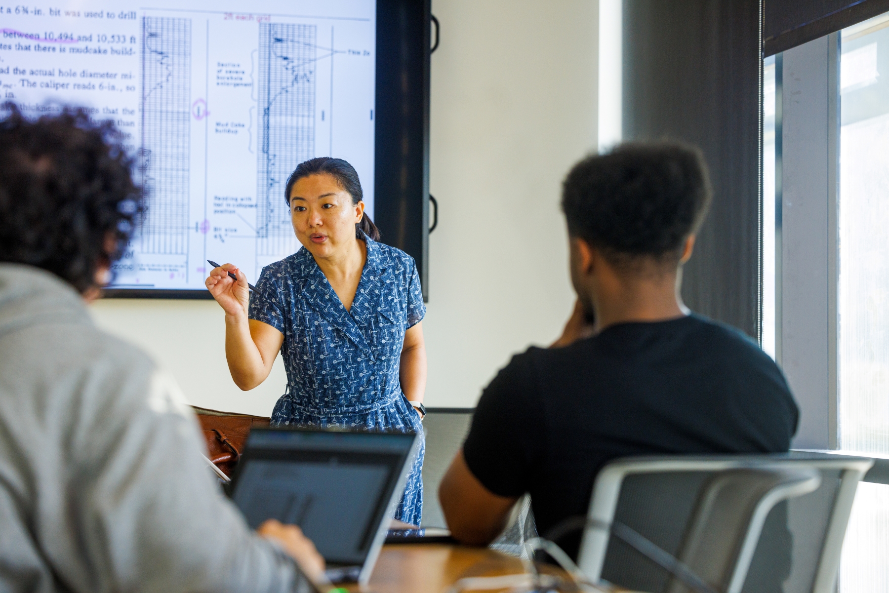 A teacher gives a lecture in a classroom on the University of Kansas campus.