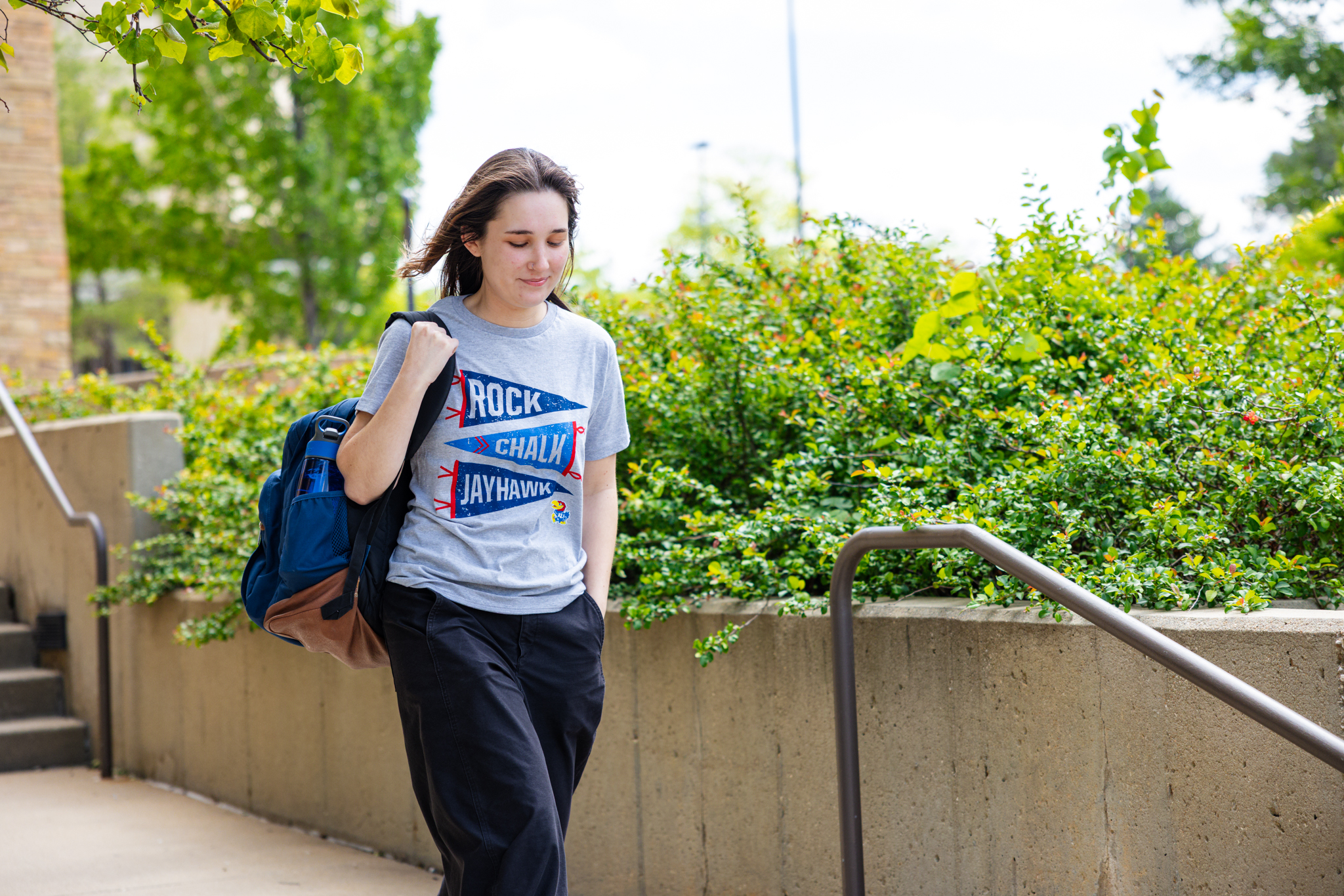 University of Kansas transfer engineering student Emily Messenger walks in front of the Spahr Engineering classroom on campus.