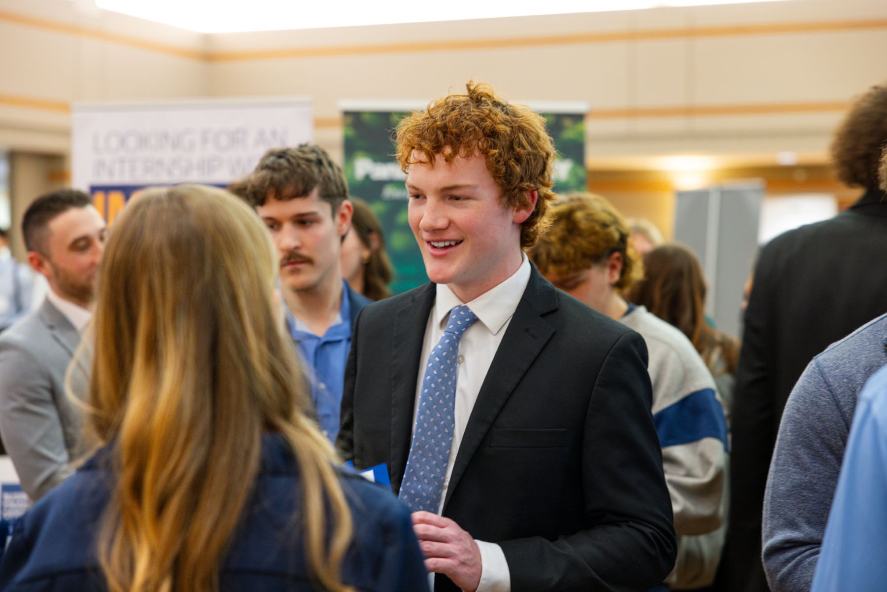 A University of Kansas student meets with a company representative at a KU Career Fair. 