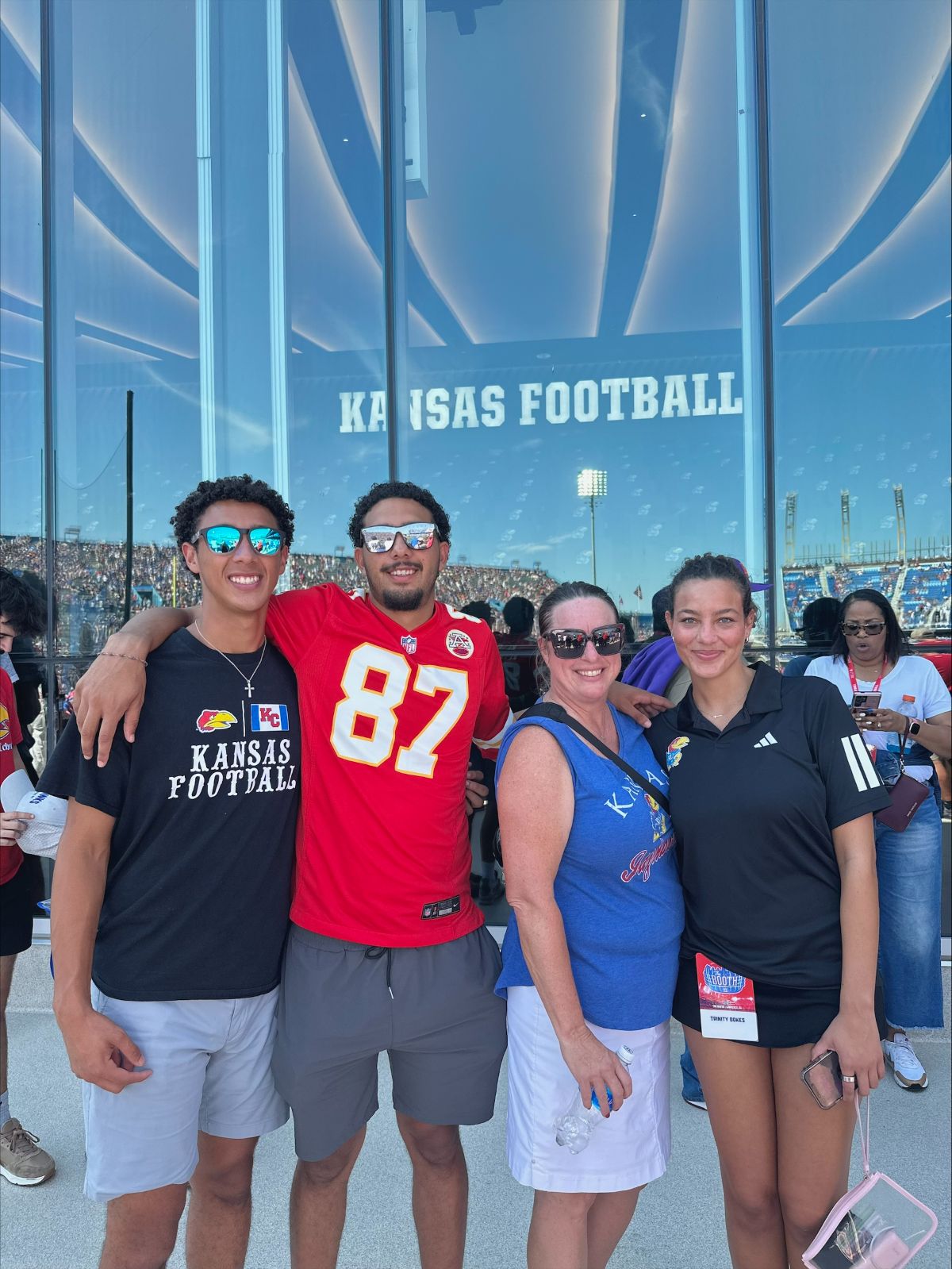 KU student Trinity Dokes poses with her family during a KU football game.