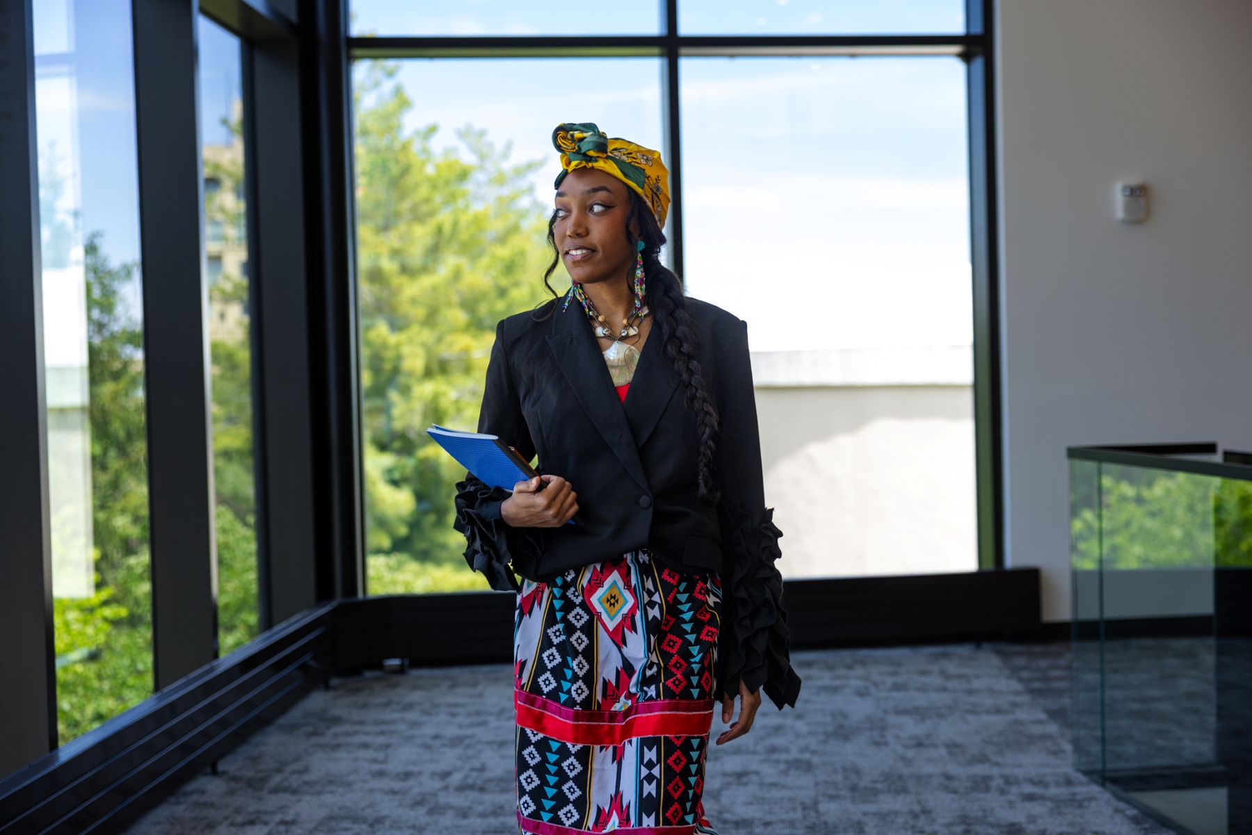 University of Kansas Indigenous Studies Masters student Lauryn Callis walks through the Jayhawk Welcome Center.