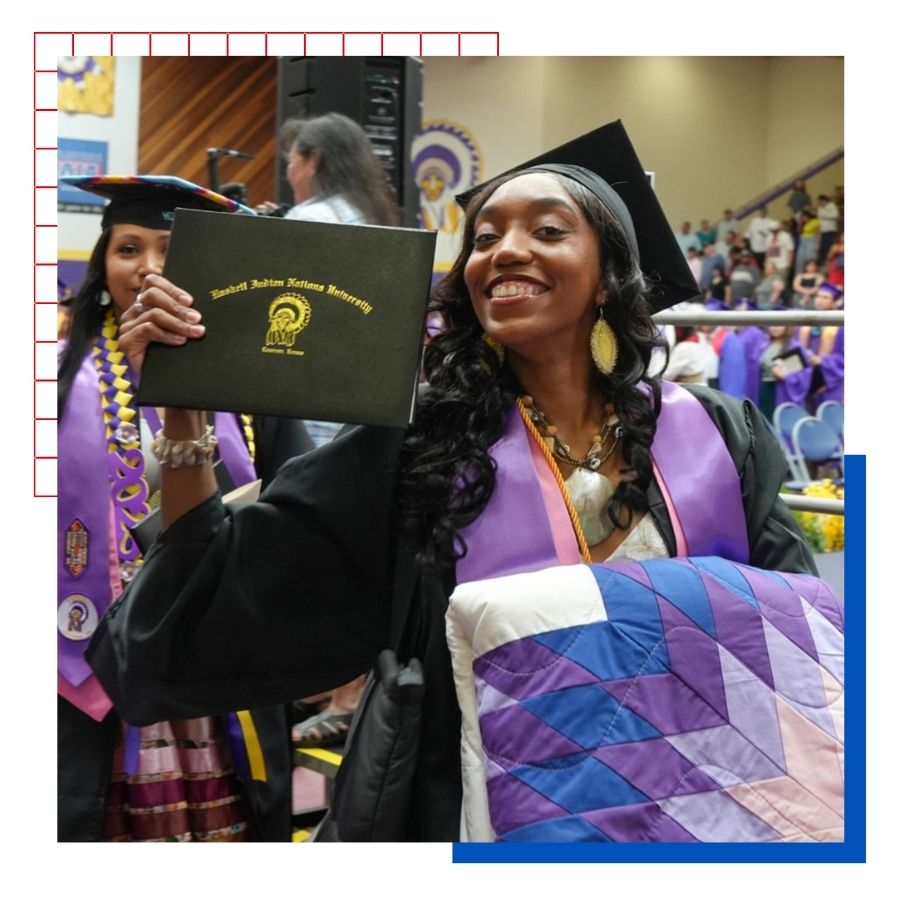 KU Indigenous Studies master's student Lauryn Callis poses with her diploma at her undergraduate graduate ceremony at Haskell Indian Nations University. 