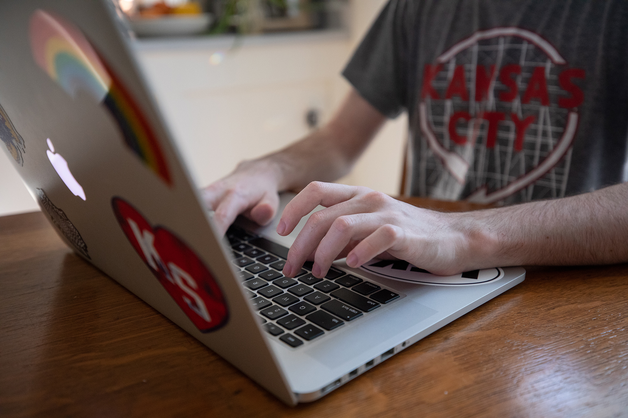 A KU student, working on a laptop computer.