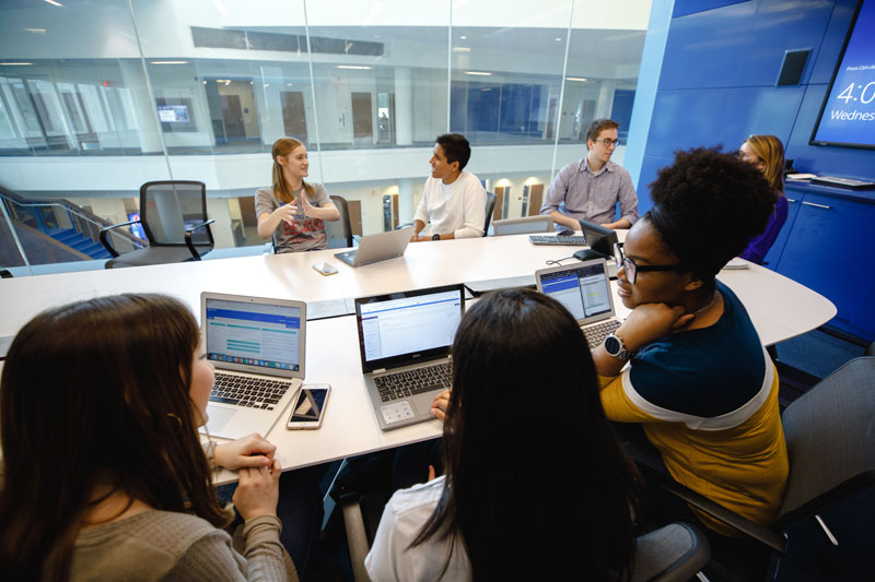 Business school students in conference room