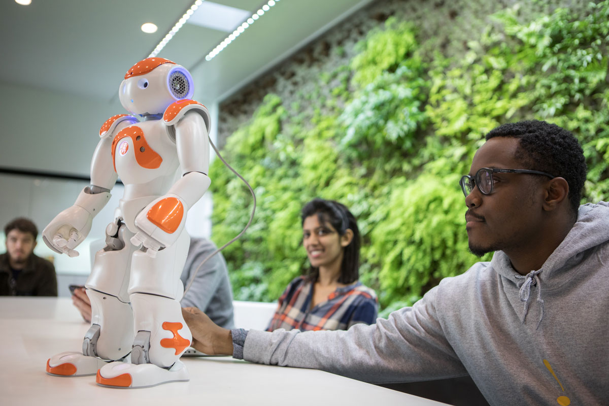Students with a dancing robot