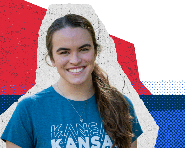"Photo of Piper. Se is wearing a blue shirt with the word Kansas in white. The background of the photo has been replaced with an animated background consisting of paper textures, red and blue dots and limestone texture."